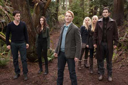 Robert Pattinson and Kristen Stewart and the Cullens in BREAKING DAWN PART 2